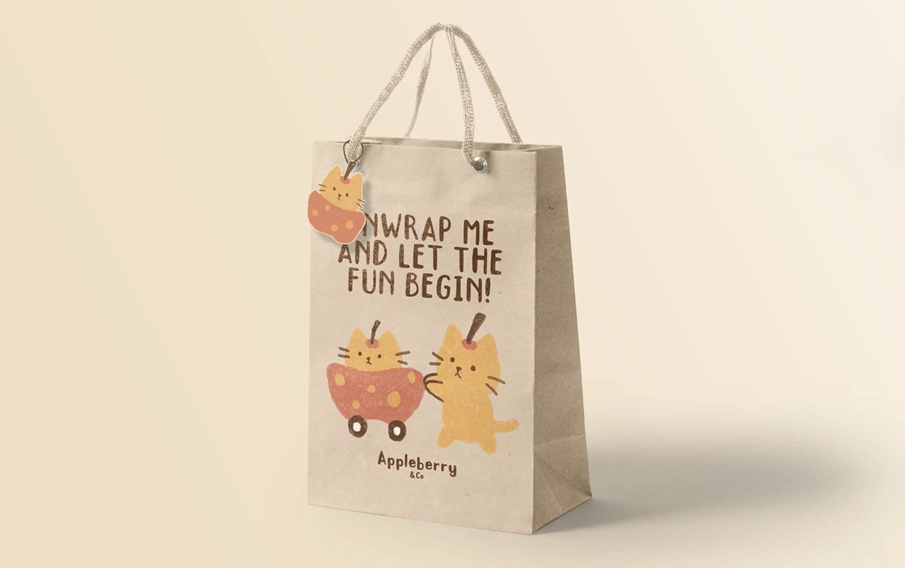 Appleberry & Co paper shopping bag printed with Unwrap me and let the fun begin