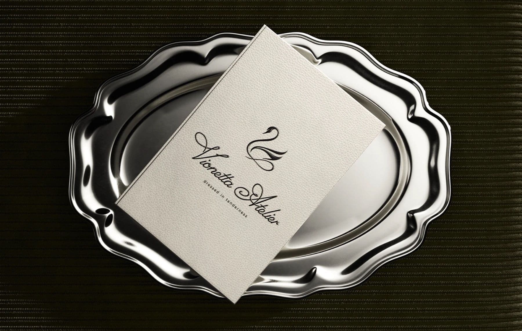 Vionetta Atelier card presented on a silver serving tray